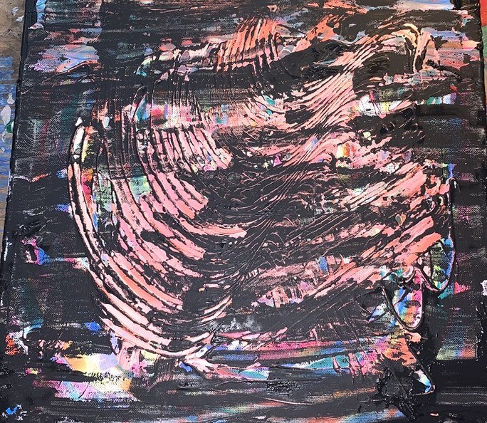 Black canvas combed open to reveal salmon pink underneath