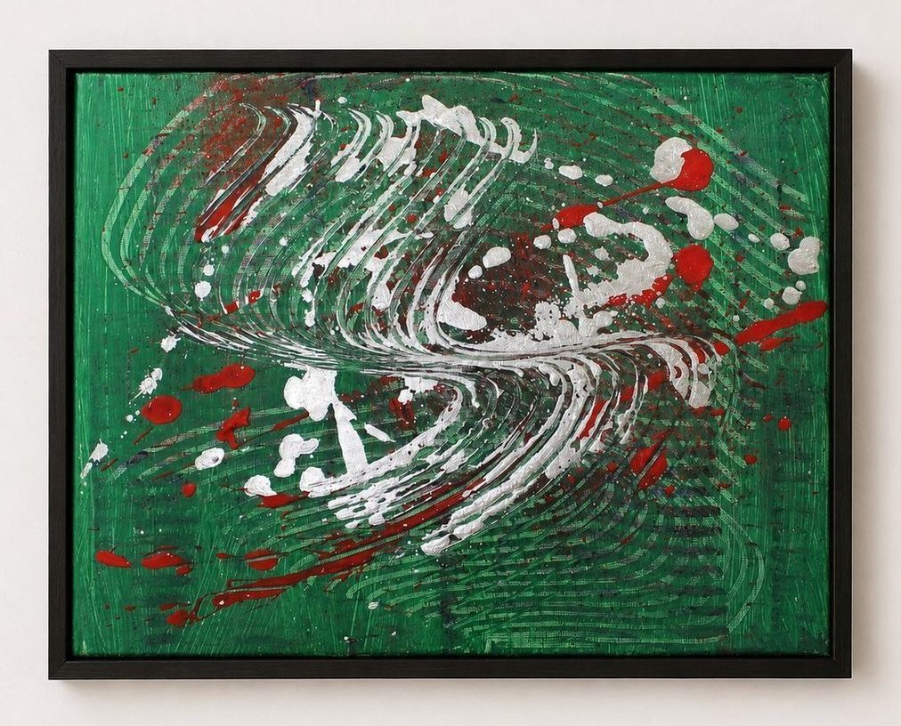 A green canvas with a white and red swirl, in a black frame