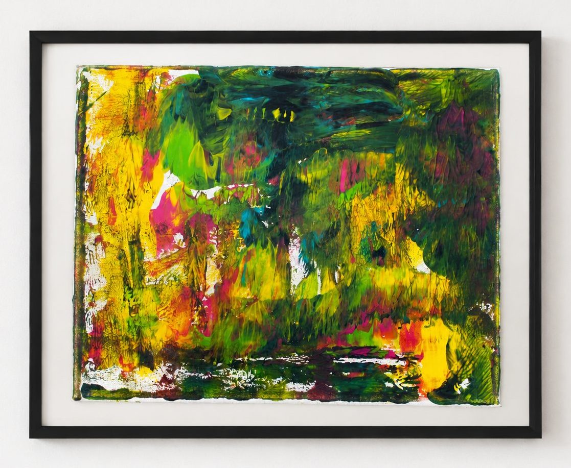 A green and yellow field with red flecks, in a black frame