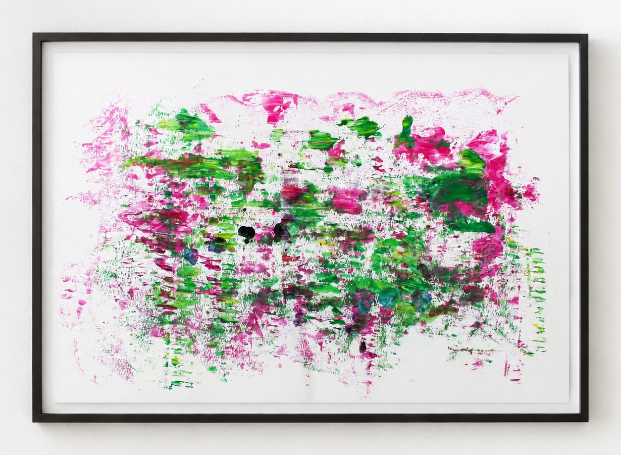 Pink and green scraped marks on white paper, in a black frame