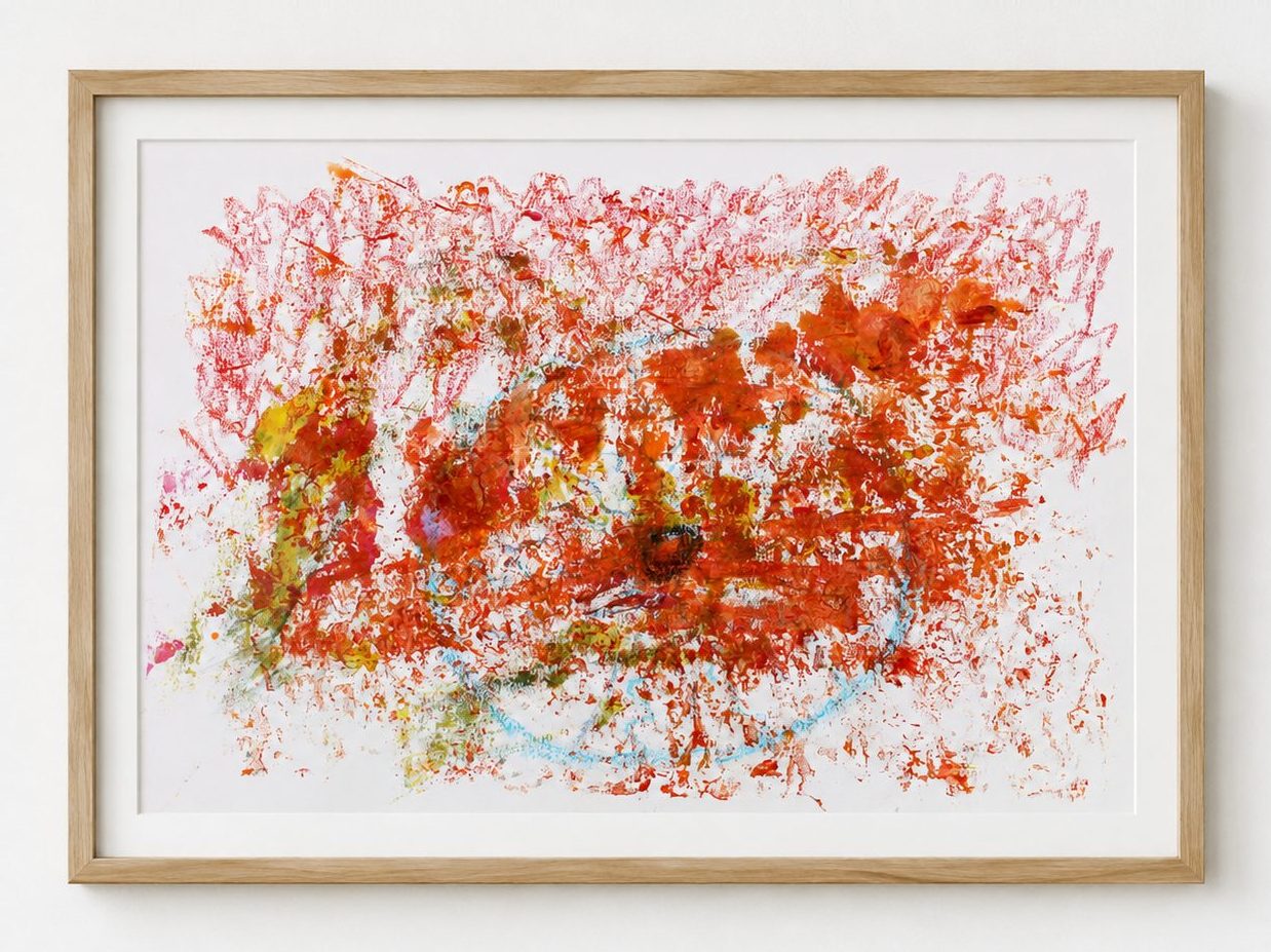 An orange speckled field on white paper, in a pale oak frame