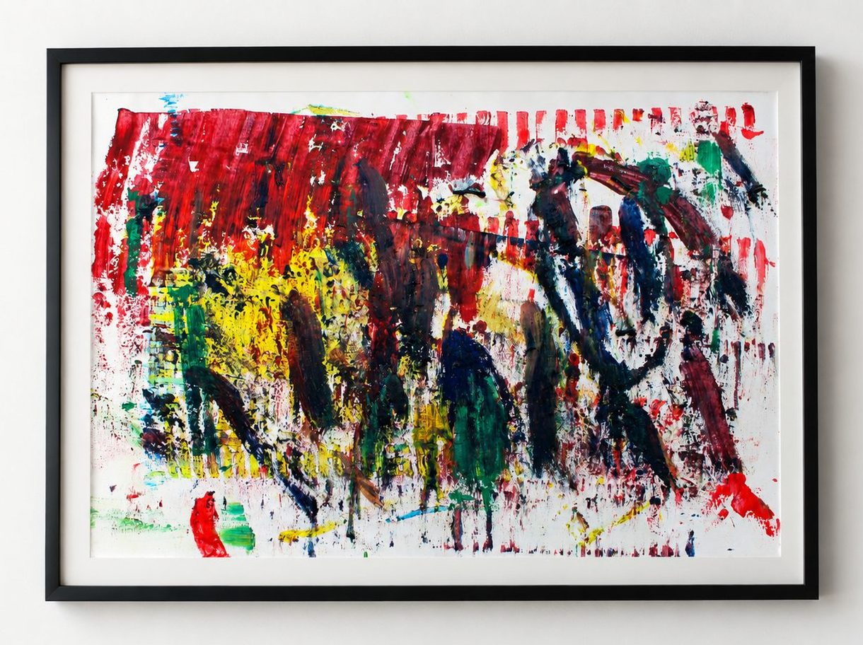 Red, yellow and black strokes across white paper, in a black frame