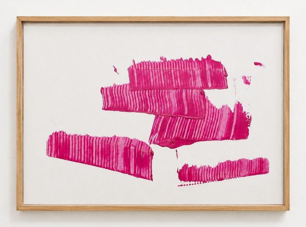 Pink combed bands on white paper, in an oak frame
