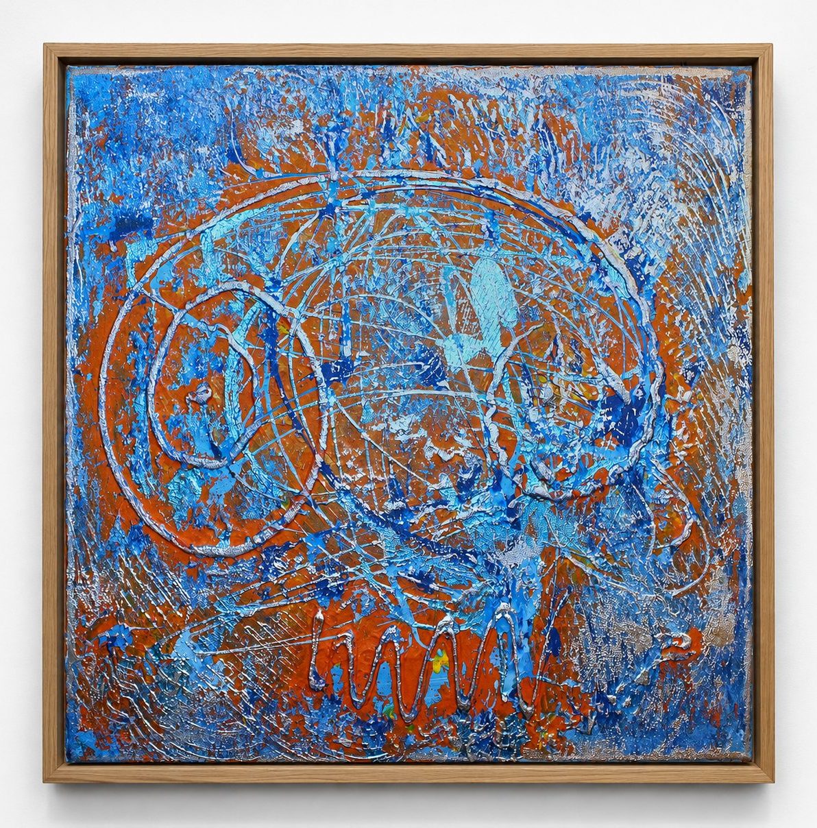 Rust circles scored into a blue ground, in a pale oak frame